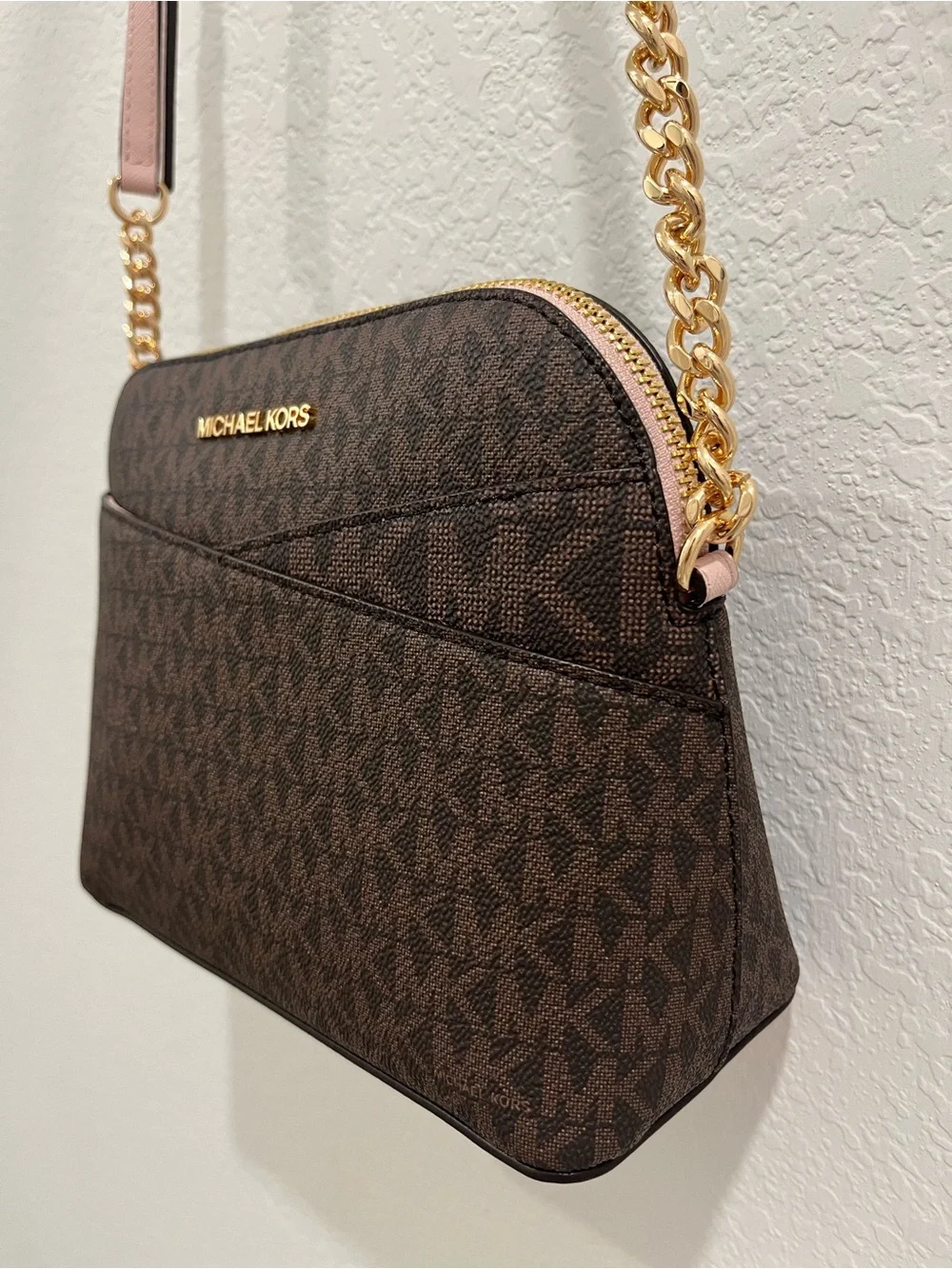 Michael Kors Brown Monogram Crossbody with Pink Trim and Gold Chain Brand new .